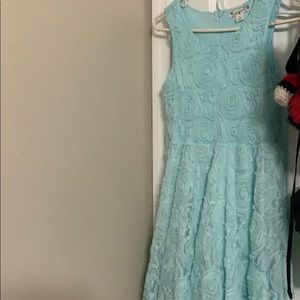 A light blue dress with flower details